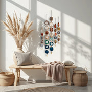 Nestled corner of a room with a wooden bench, decorative pillows, and wall art.