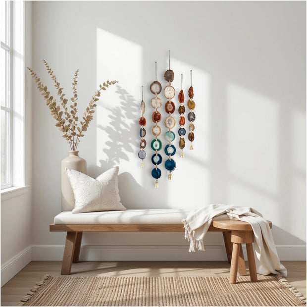 Nestled corner with a wooden bench, decorative wall art, and a vase with plants.