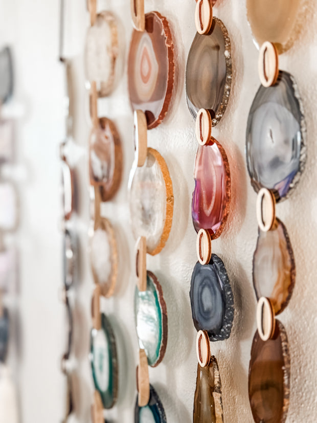 Collection of colorful agate slices on a white background