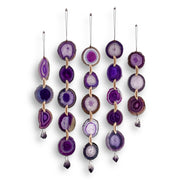 Set of purple agate hanging decorations on a white background