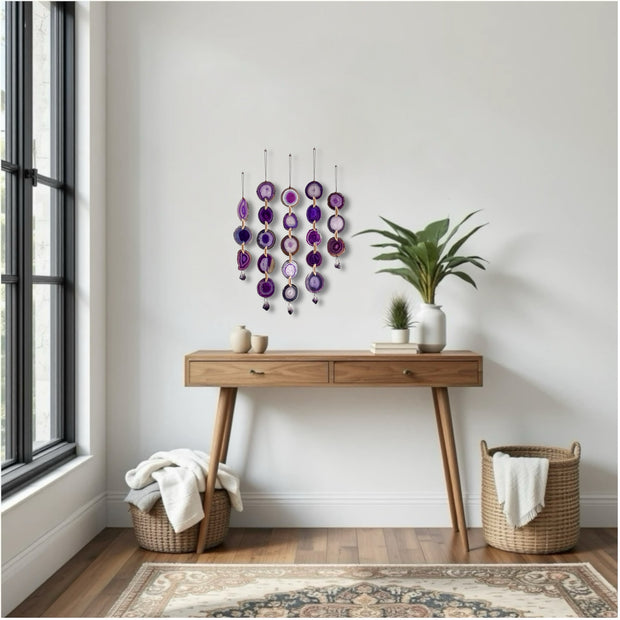 Wooden console table with decorative items against a white wall