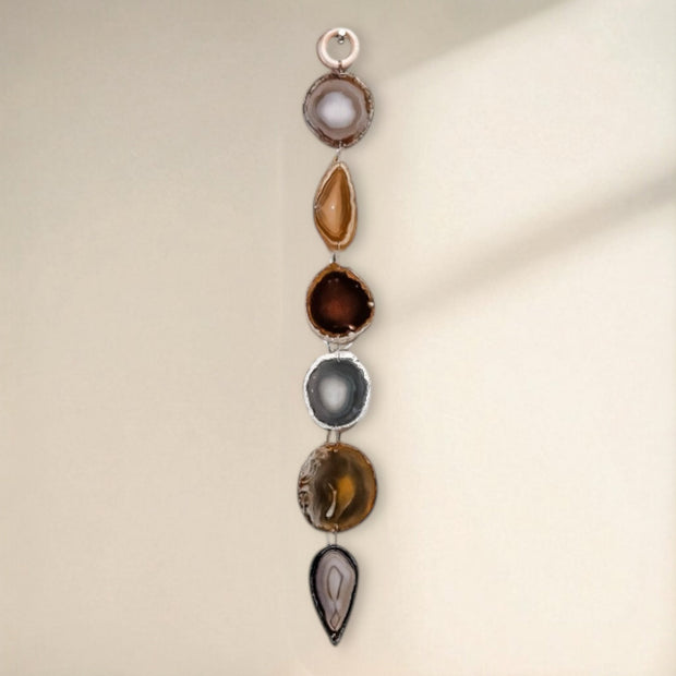 Jewelry with multiple stones on a beige background