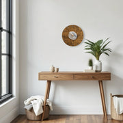 a wooden table with a potted plant on top of it